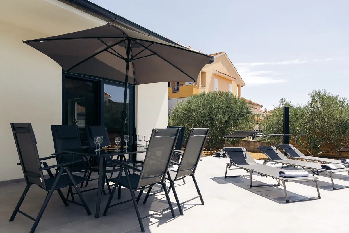 Terrace dining area with pool view